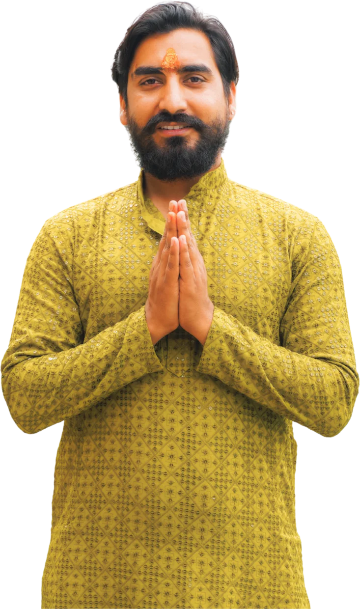 Yogi Manoj, founder and lead teacher of Mimamsa Yogshala, standing in namaste